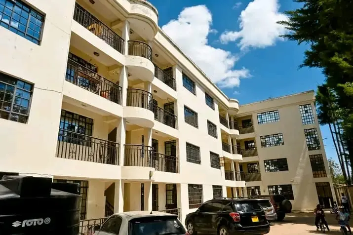 Apartment block with balconies and parking